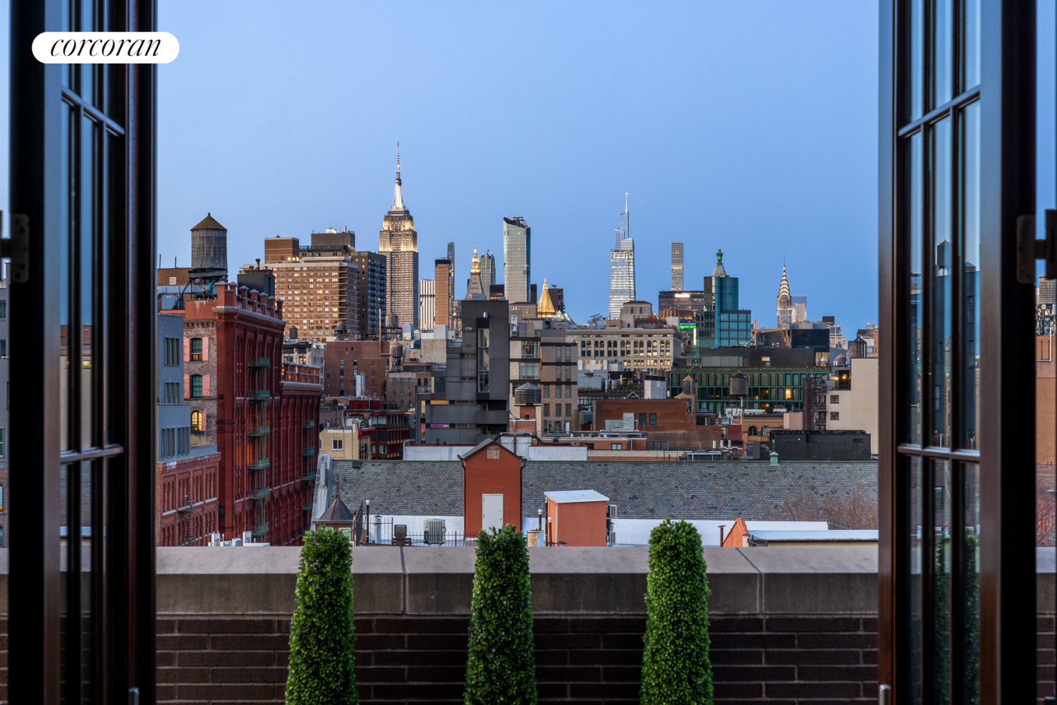 224 Mulberry Street, Unit PH Manhattan, NY 10012 - Photo 32 of 37 a city view with tall buildings