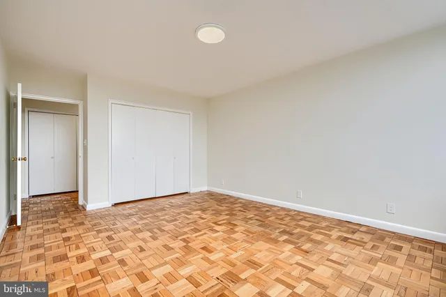 a work room with furniture and a book shelf