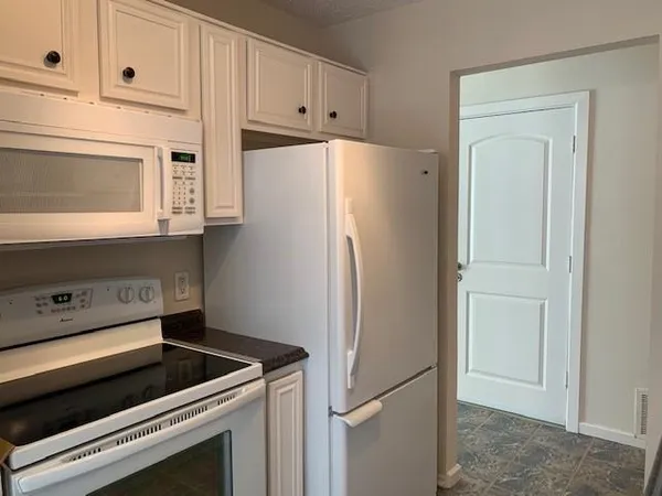 a bathroom with a toilet and a shower curtain