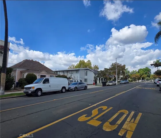 a view of street with parked cars