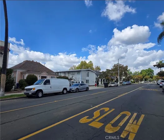 a view of street with parked cars