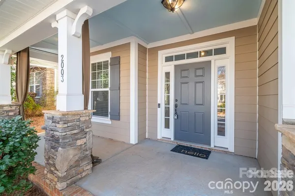 a kitchen with stainless steel appliances granite countertop a refrigerator a sink dishwasher a stove top oven a refrigerator and cabinets