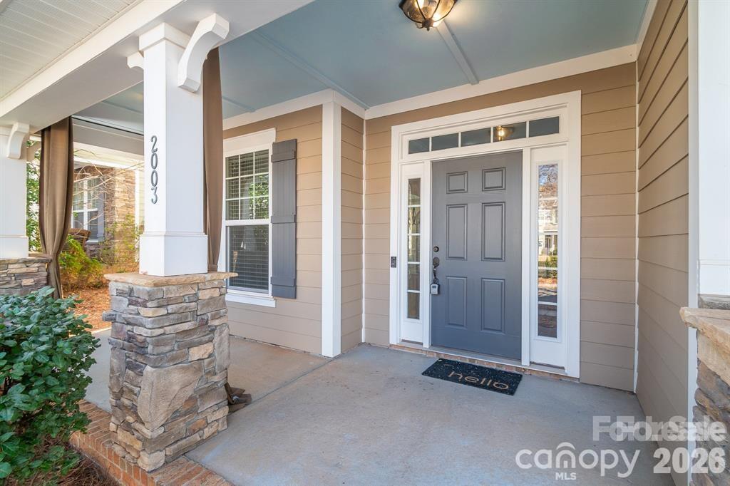 2003 Fallondale Road Waxhaw, NC 28173 - Photo 2 of 31 a view of an entryway with wooden floor and a livingroom