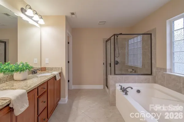 a view of room with window and ceiling fan