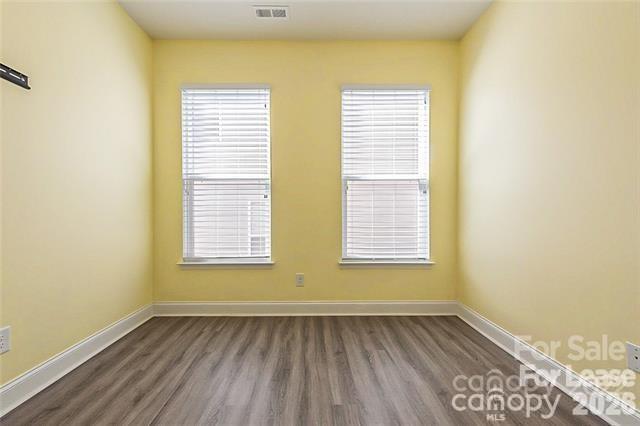 2003 Fallondale Road Waxhaw, NC 28173 - Photo 27 of 31 a view of an empty room with wooden floor and a window