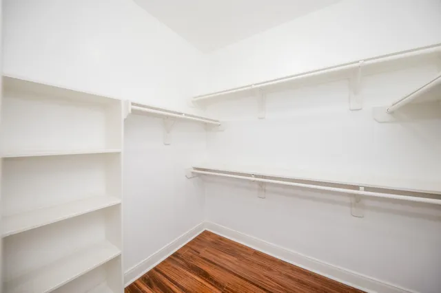 a view of an empty walk in closet