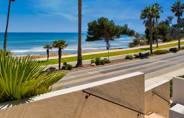 a view of a street with a park