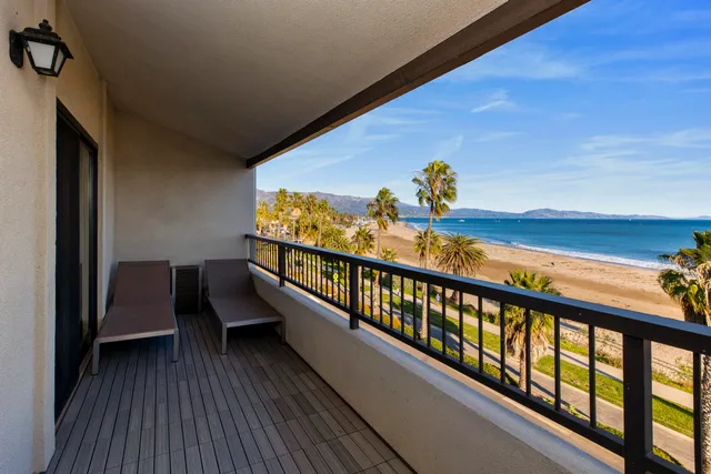 a view of balcony with furniture