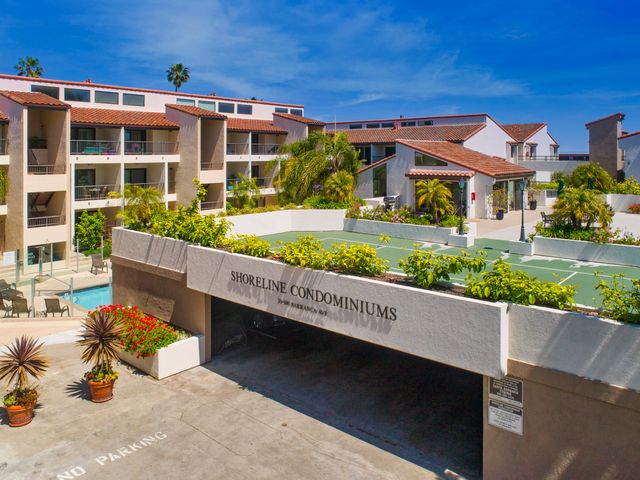 a view of a house with a yard and sitting area