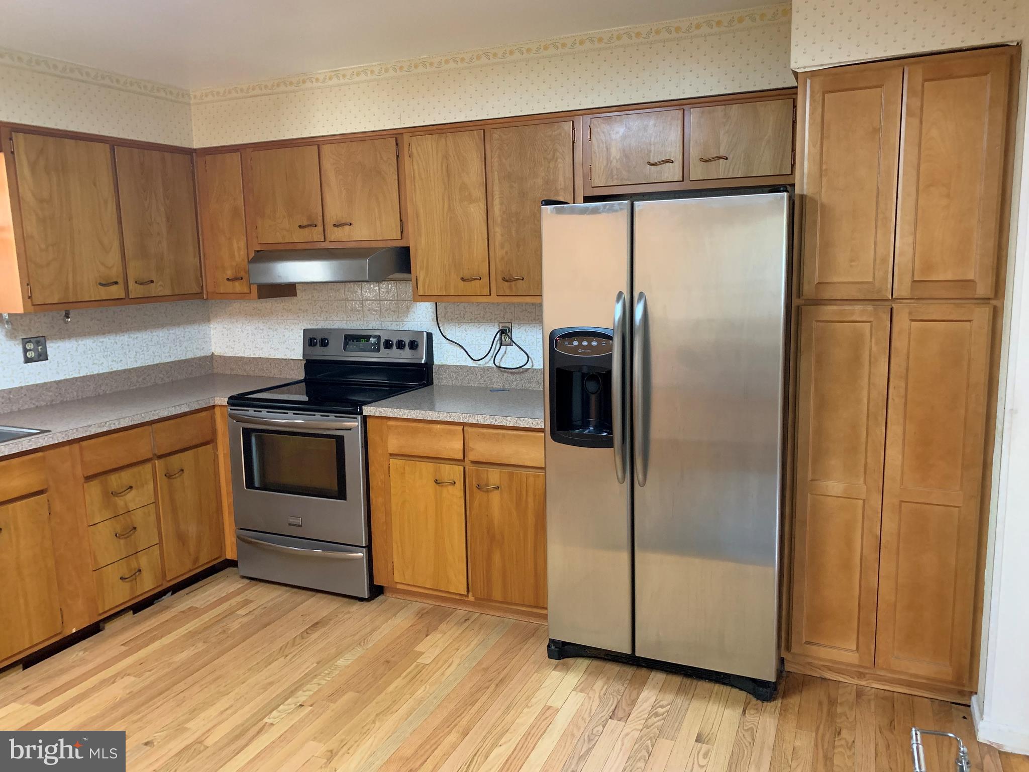 5317 Tolson Road Temple Hills, MD 20748 - Photo 8 of 23 VIEW OF KITCHEN WITH HARDWOOD FLOOR