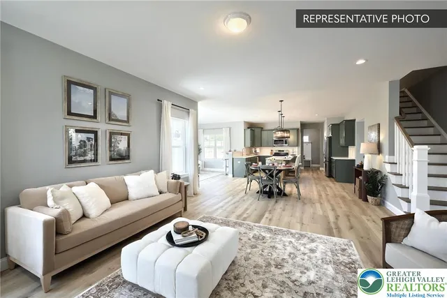 a living room with furniture dining table and a couch