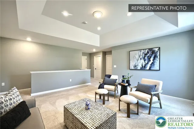 a living room with furniture and a rug