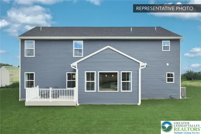 a view of front of house with a yard