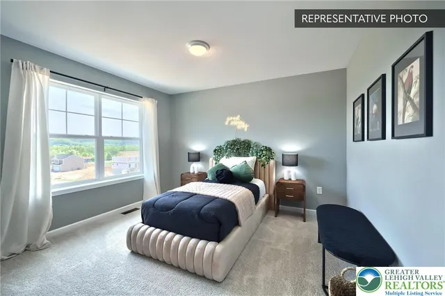 a bedroom with a bed window and a couch