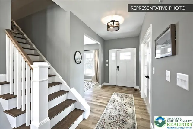 a view of an entryway with wooden floor