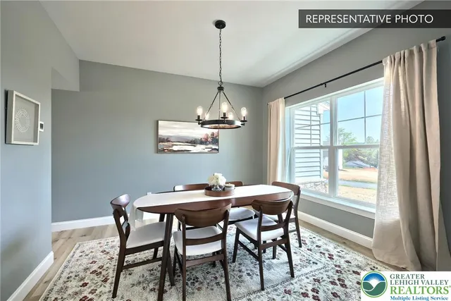 a dining room with furniture and window