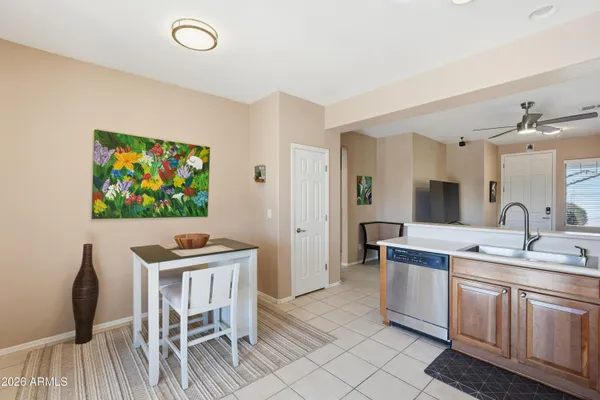 a view of a kitchen area with furniture and wooden floor