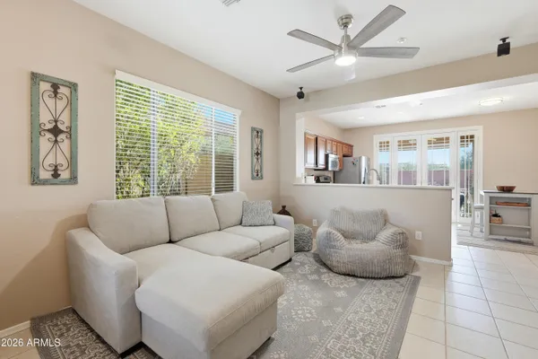a living room with furniture and a large window