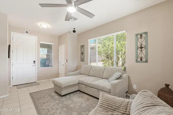 a living room with furniture and a window