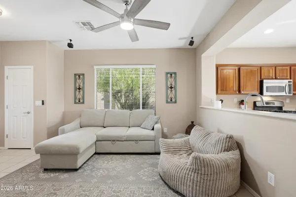a living room with furniture and a large window