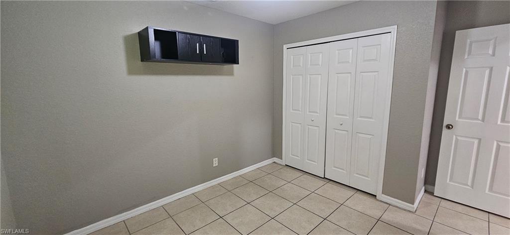4530 30th Street Southwest Lehigh Acres, FL 33973 - Photo 3 of 6 a view of a hallway