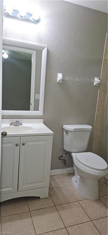 4530 30th Street Southwest Lehigh Acres, FL 33973 - Photo 4 of 6 a bathroom with a toilet and a mirror