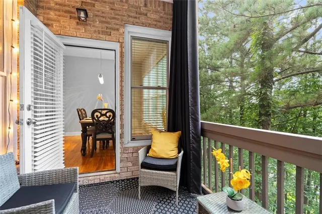 a bedroom with a bed a window and a chandelier