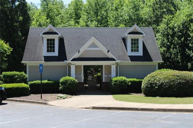 a street sign on a wall next to a building