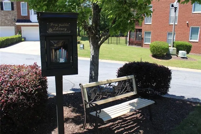 a view of a swimming pool with outdoor seating
