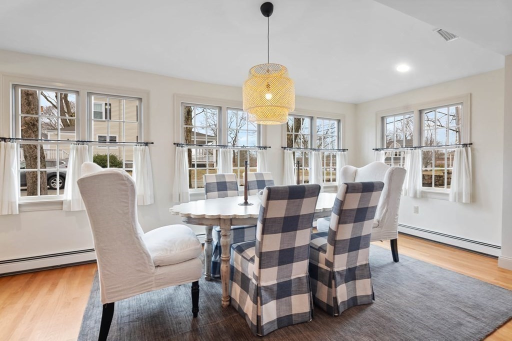 10 Union Street Hingham, MA 02043 - Photo 11 of 40 a dining room with furniture a window and wooden floor