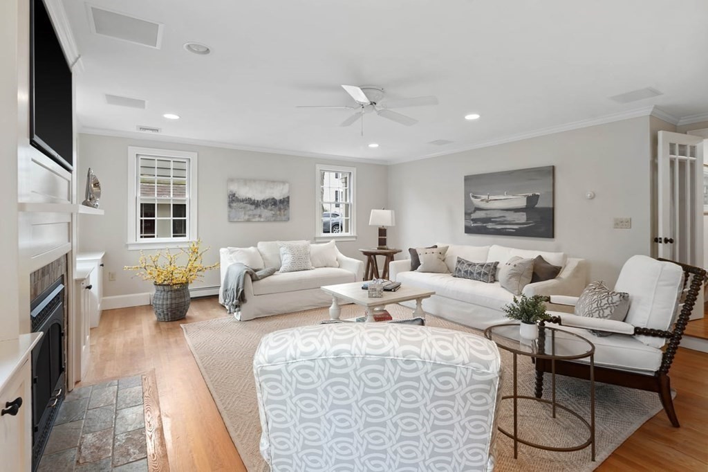 10 Union Street Hingham, MA 02043 - Photo 16 of 40 a living room with fireplace furniture and a flat screen tv