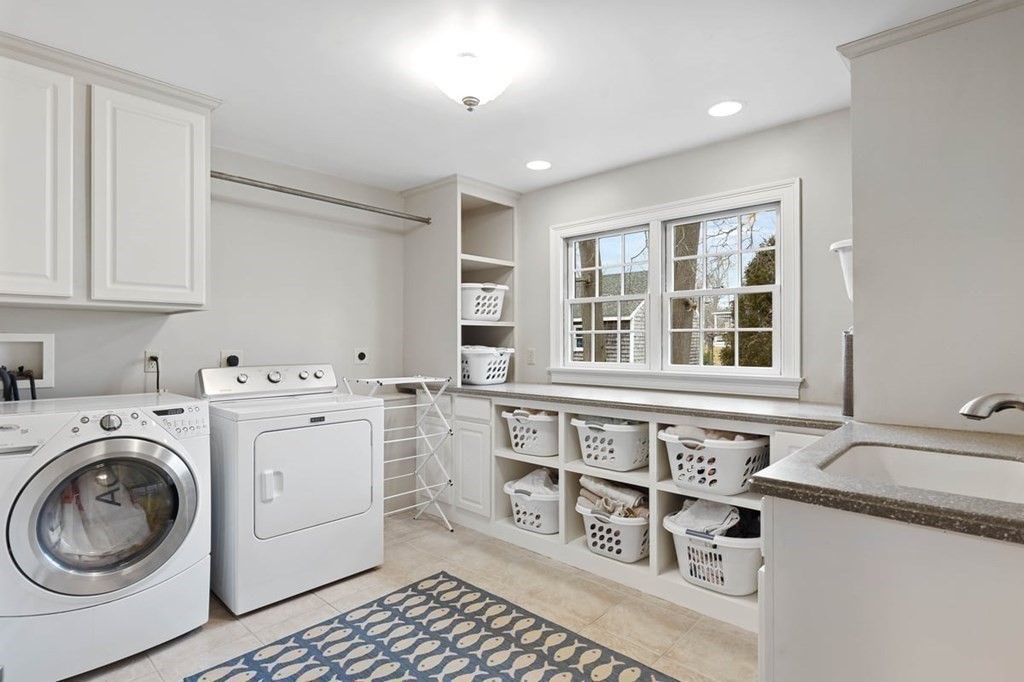 10 Union Street Hingham, MA 02043 - Photo 19 of 40 a utility room with sink dryer and washer