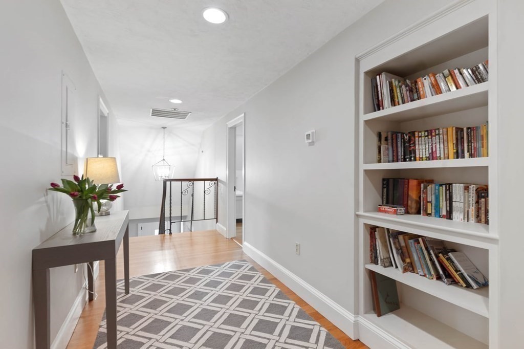 10 Union Street Hingham, MA 02043 - Photo 21 of 40 a living room with furniture and a book shelf