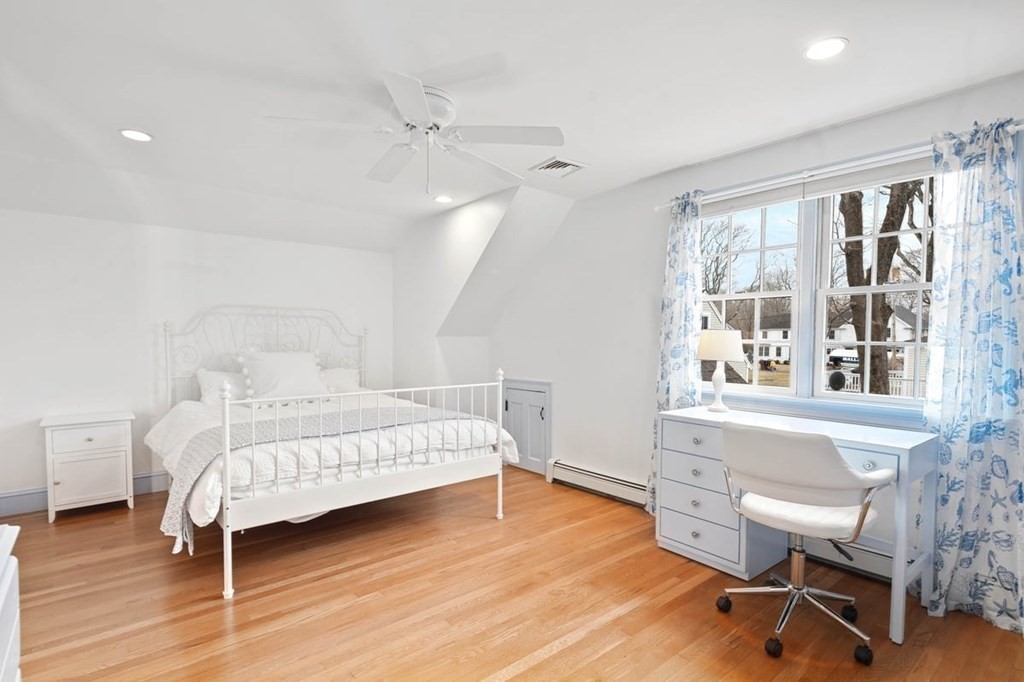 10 Union Street Hingham, MA 02043 - Photo 27 of 40 a bedroom with a bed and a large window