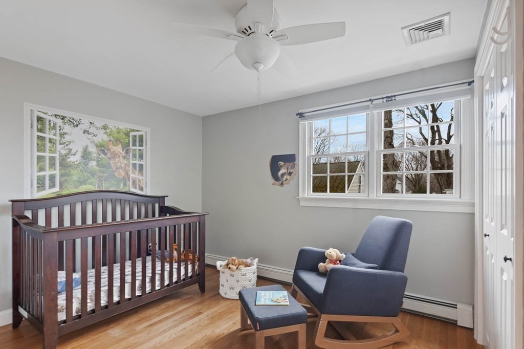10 Union Street Hingham, MA 02043 - Photo 29 of 40 a bedroom with furniture window and wooden floor