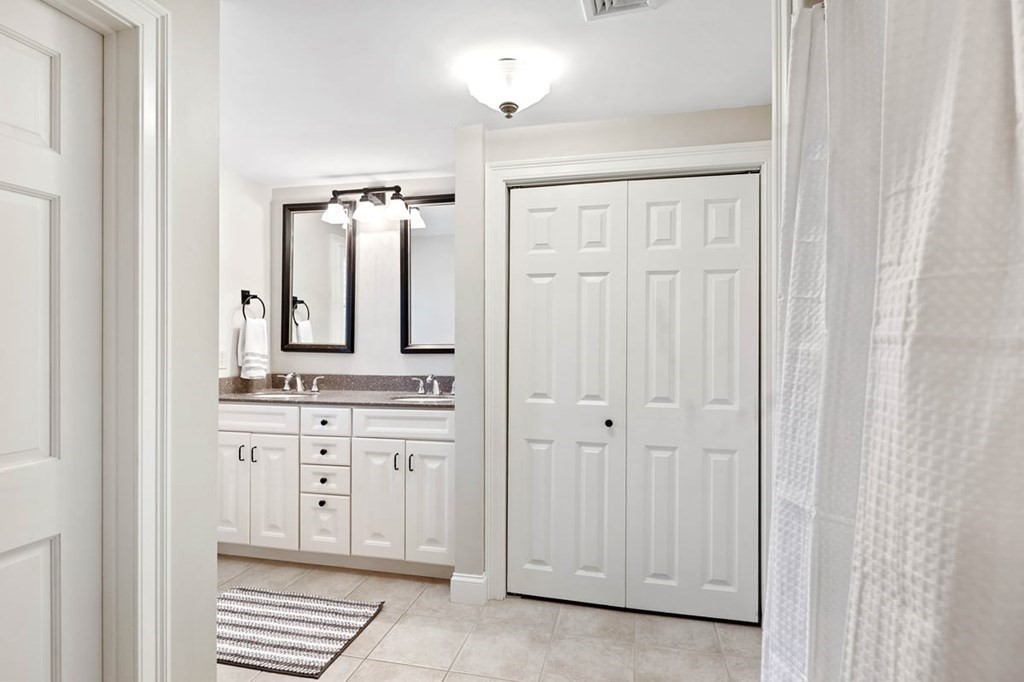 10 Union Street Hingham, MA 02043 - Photo 33 of 40 a bathroom with a sink a vanity and a mirror
