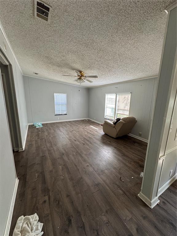 4266 County Road 691 Webster, FL 33597 - Photo 12 of 22 a view of a livingroom with wooden floor and staircase