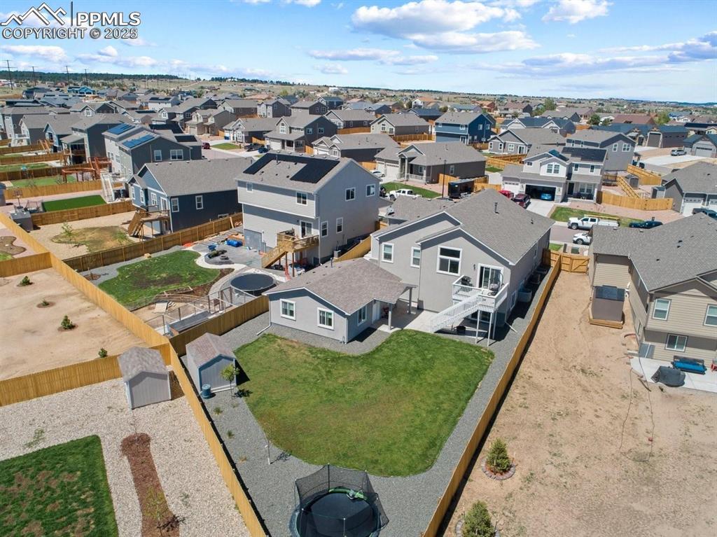 10052 Bracknell Place Peyton, CO 80831 - Photo 1 of 36 an aerial view of a house with a garden