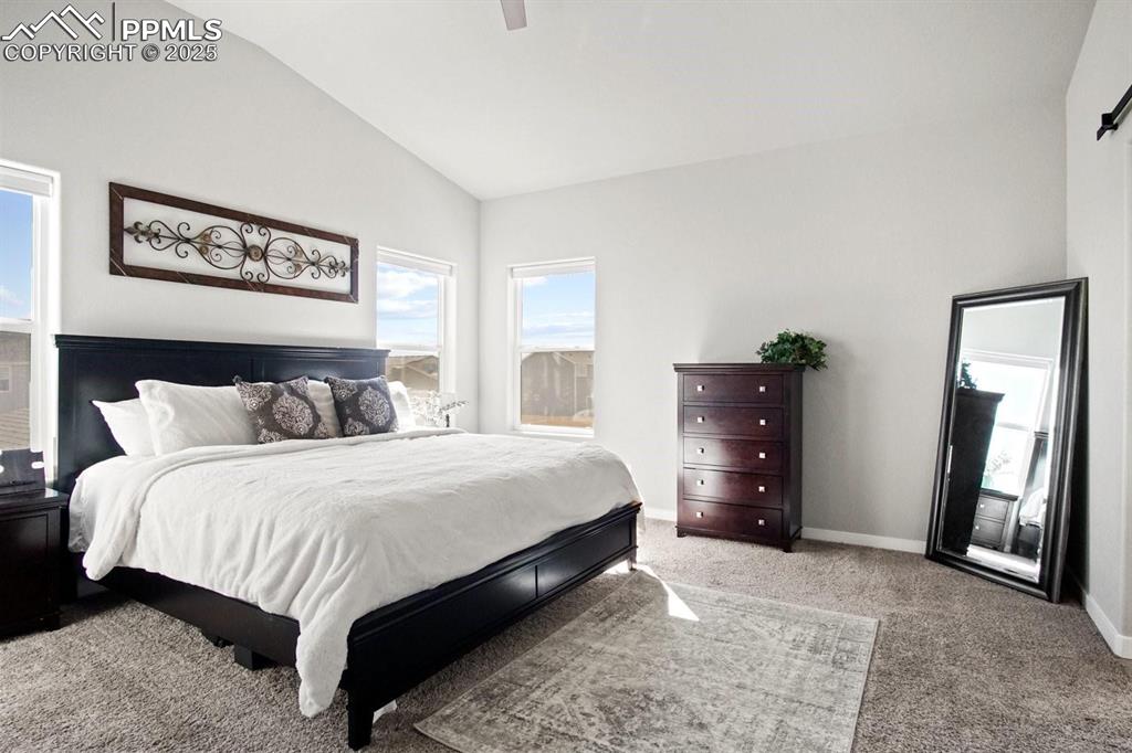 10052 Bracknell Place Peyton, CO 80831 - Photo 14 of 36 a bedroom with bed and window
