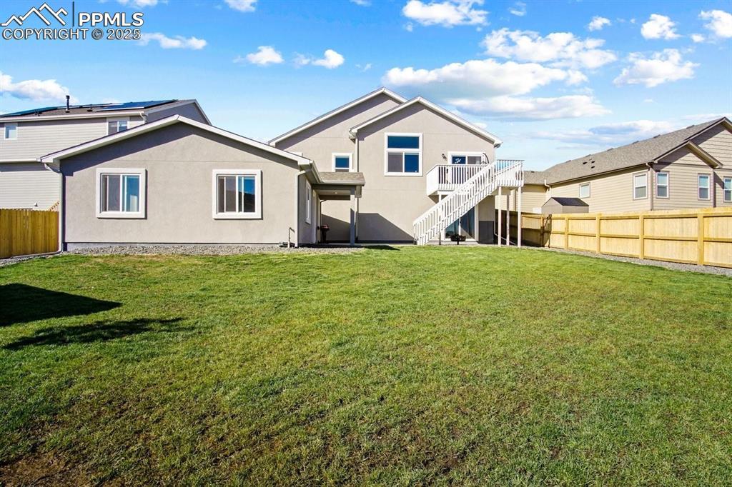 10052 Bracknell Place Peyton, CO 80831 - Photo 2 of 36 a view of a house with a yard