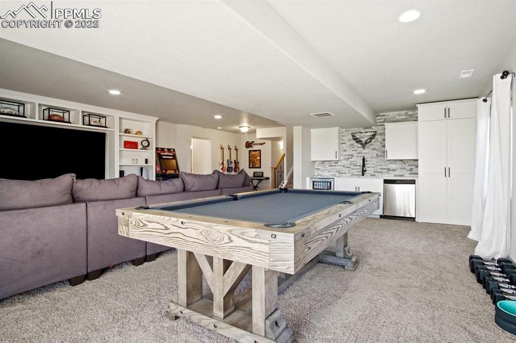 10052 Bracknell Place Peyton, CO 80831 - Photo 26 of 36 a large kitchen with a table and chairs