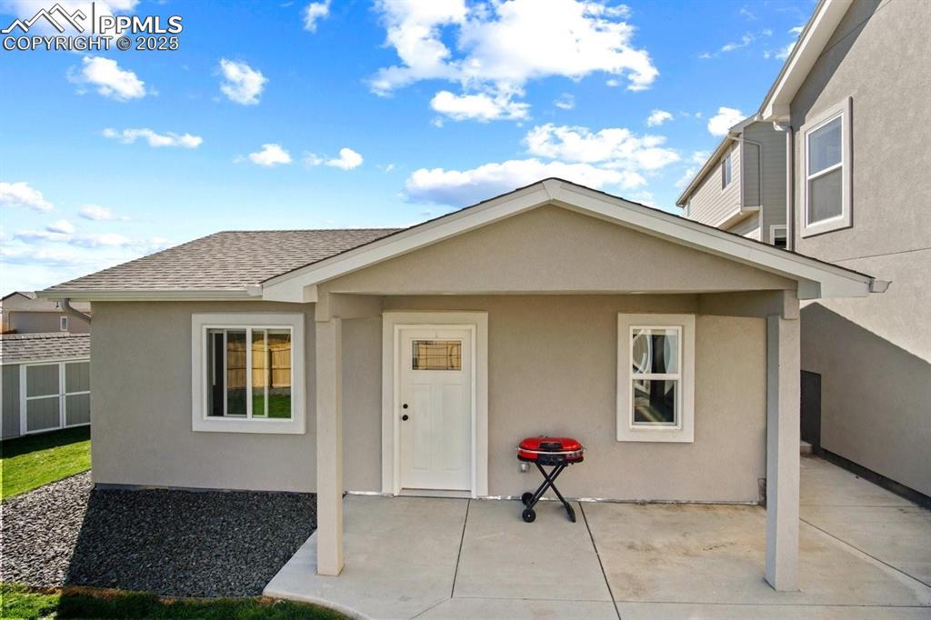 10052 Bracknell Place Peyton, CO 80831 - Photo 30 of 36 a view of house with backyard