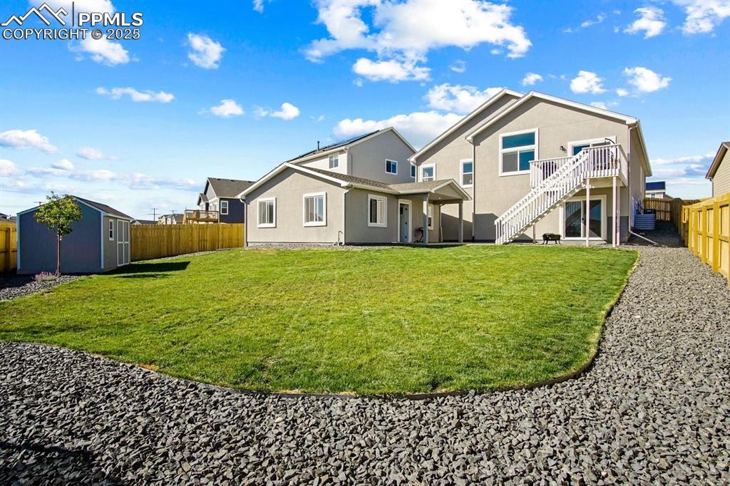 10052 Bracknell Place Peyton, CO 80831 - Photo 3 of 36 a view of a house with a yard