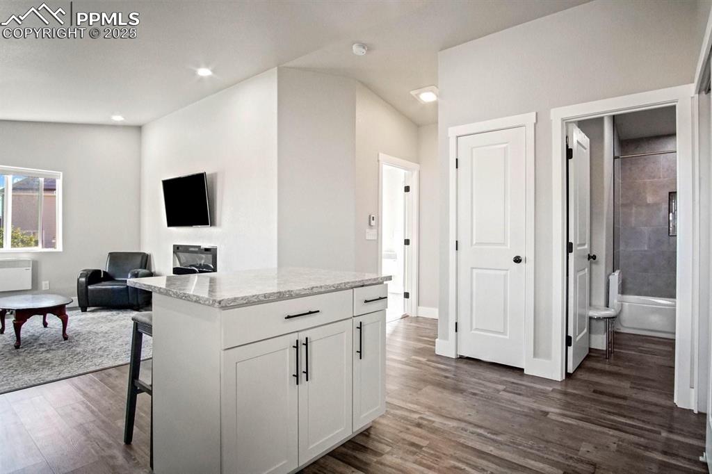 10052 Bracknell Place Peyton, CO 80831 - Photo 33 of 36 a view of a workspace with furniture and wooden floor