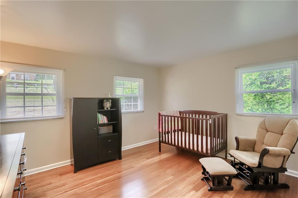 3275 Ridge Rd Extension Freedom, PA 15042 - Photo 14 of 25 Another guest bedroom on the main level features gorgeous hardwood floors, big bright windows and ample storage.