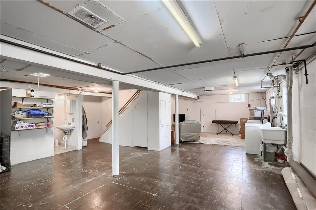 3275 Ridge Rd Extension Freedom, PA 15042 - Photo 20 of 25 The lower level is versatile space ready for your need. A full bathroom, access to the rear yard and garage are provided here.