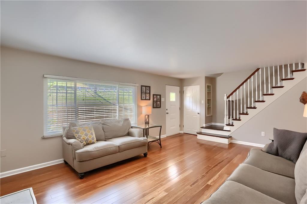 3275 Ridge Rd Extension Freedom, PA 15042 - Photo 3 of 25 Large picture window, striking hardwood staircase and neutral tones are highlights of this family room.
