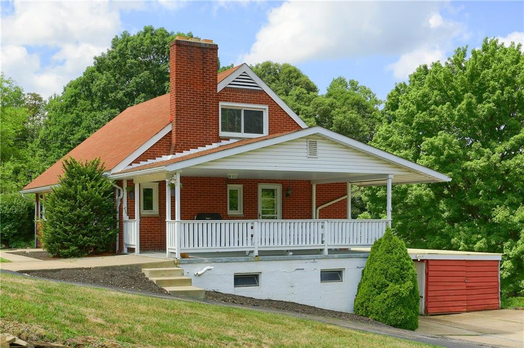 3275 Ridge Rd Extension Freedom, PA 15042 - Photo 22 of 25 Off the kitchen is the covered porch with built in bench seating.