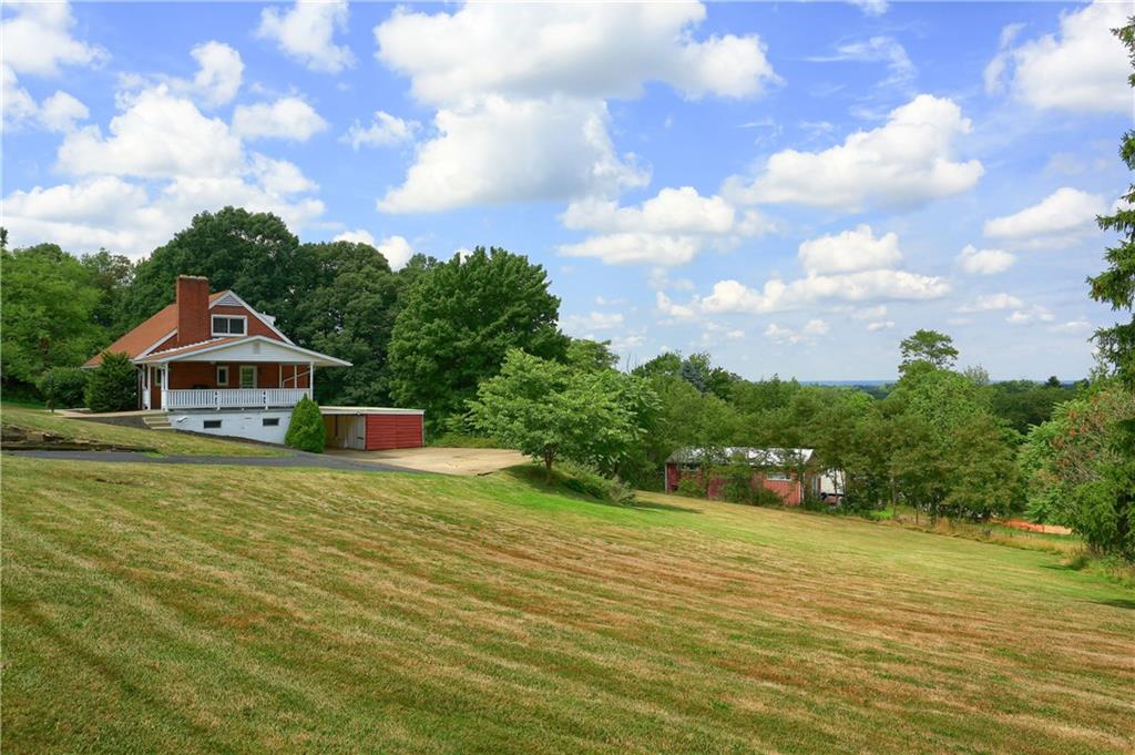 3275 Ridge Rd Extension Freedom, PA 15042 - Photo 24 of 25 The huge yard offers mature foliage, generous space for yard games and plenty of areas for a firepit, playset and picnics!