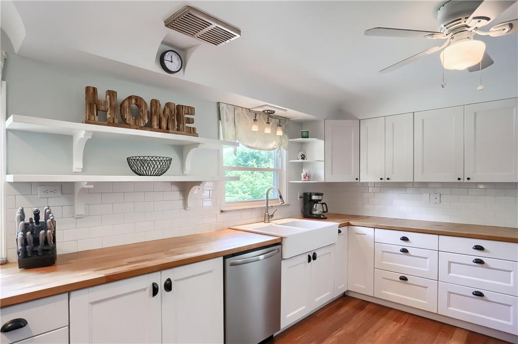 3275 Ridge Rd Extension Freedom, PA 15042 - Photo 4 of 25 The updated kitchen boasts endless butcher block counters, white shaker cabinetry, white subway tile backsplash and much more.